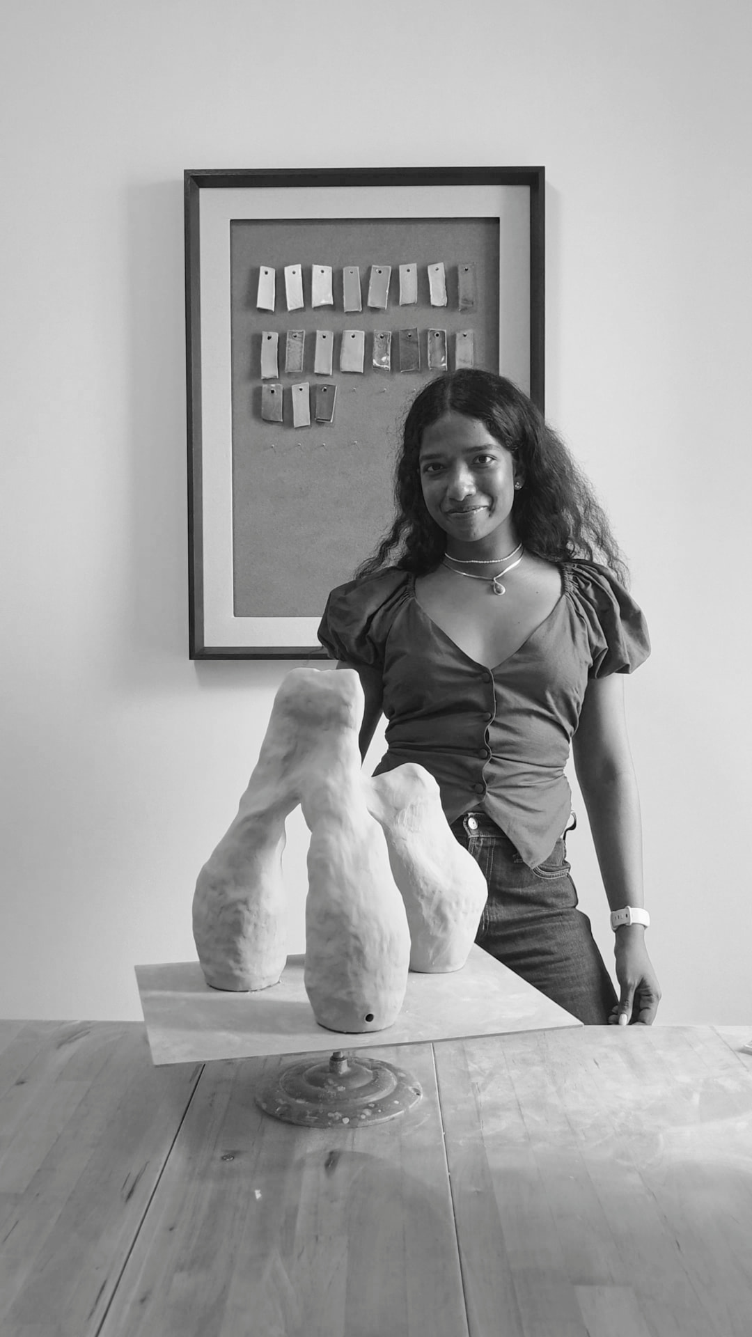 Shanti, the ceramicist behind Atelier Lille, in the studio with a handbuilt sculptural piece