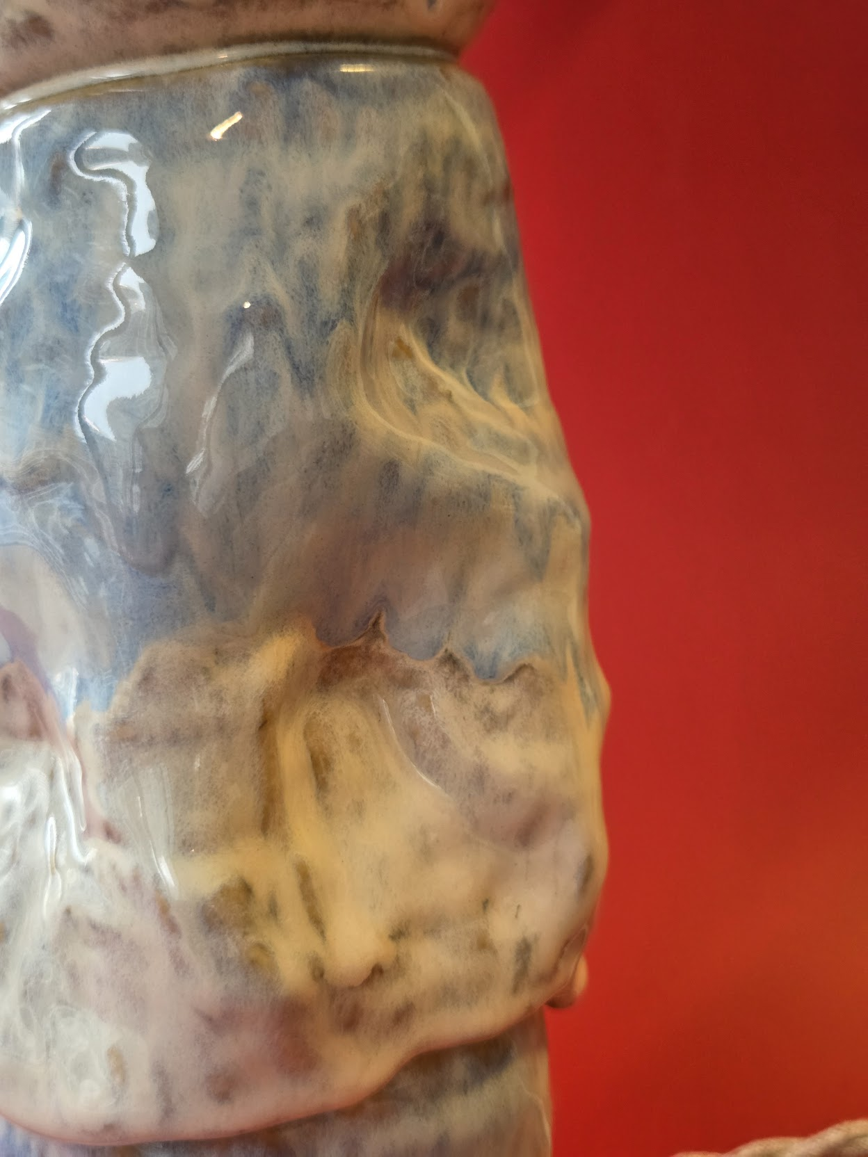 Detail of Riffle's mottled glaze flowing across the lower stacked ceramic form