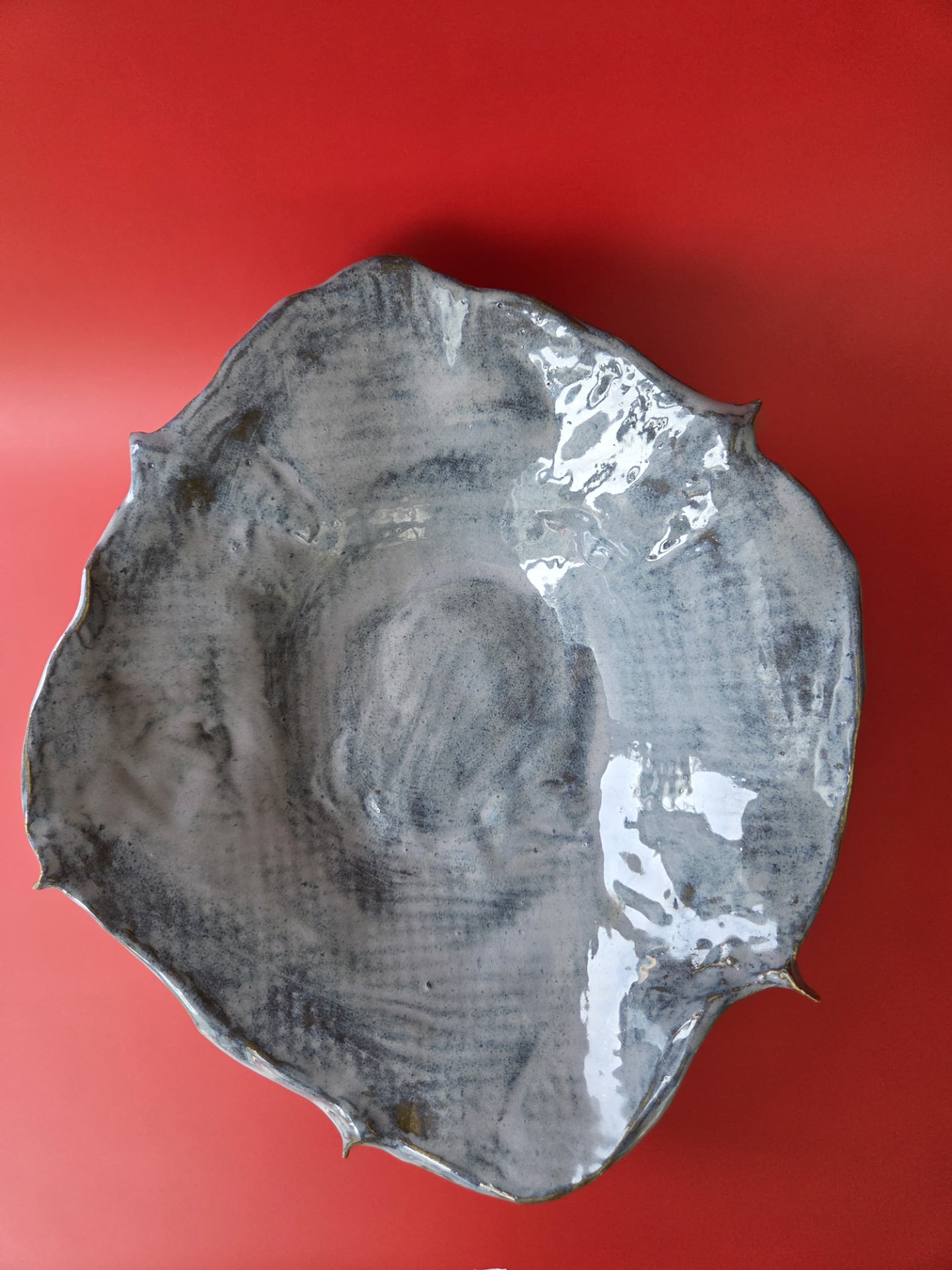 Overhead view of Caldera showing its broad form and pooled grey glaze